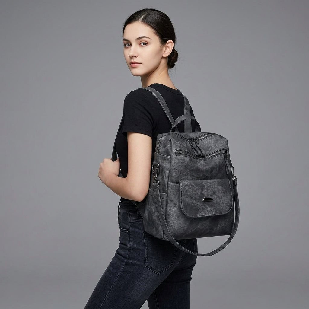 Black Leather Backpack with Triangular Metal Accent