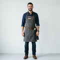Heavy-Duty Dark Grey Canvas Work Apron with Brown Leather Straps & Pockets