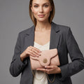 Pink Quilted Leather Crossbody Bag with Gold Circular Logo