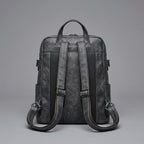 Black Leather Backpack with Triangular Metal Accent