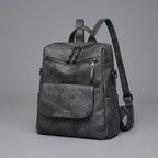 Black Leather Backpack with Triangular Metal Accent