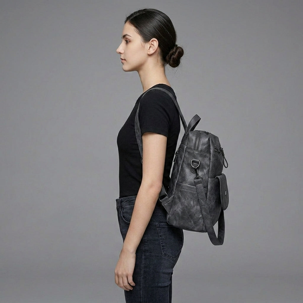 Black Leather Backpack with Triangular Metal Accent