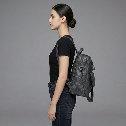 Black Leather Backpack with Triangular Metal Accent